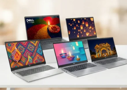 Professional laptops arranged for a festive technology sale event, featuring colorful Indian cultural designs.